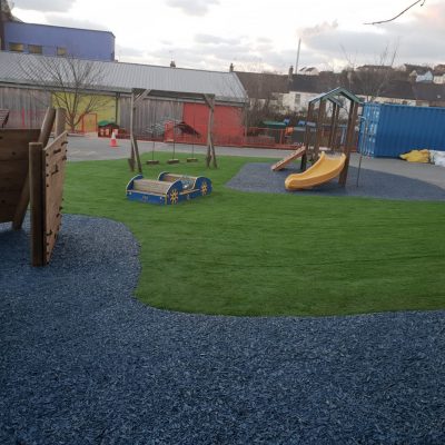 AGI Play equipment with safety mats and artificial grass